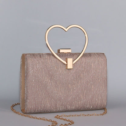 Wavy Pattern Shimmering Clutch with Heart-Shaped Handle