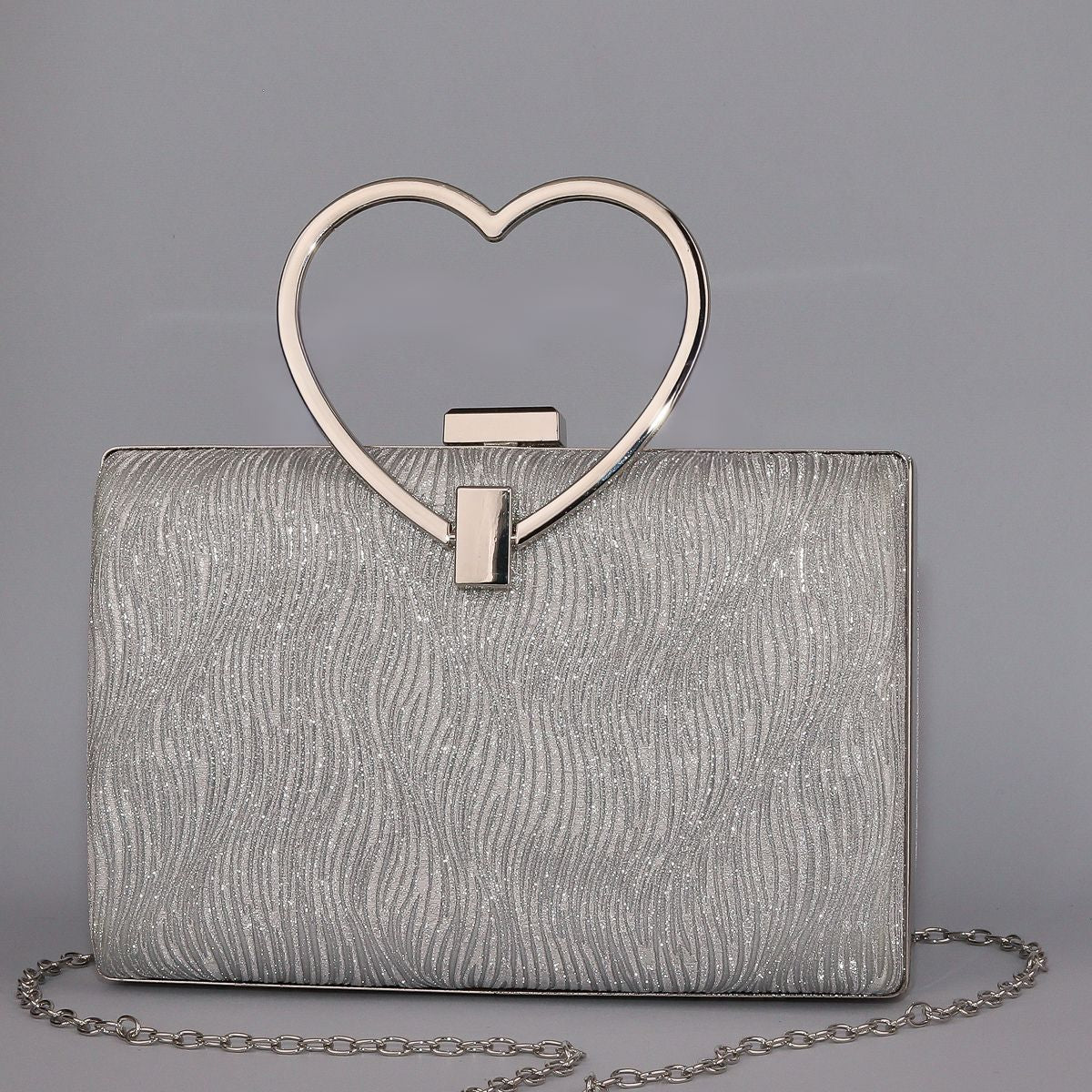 Wavy Pattern Shimmering Clutch with Heart-Shaped Handle