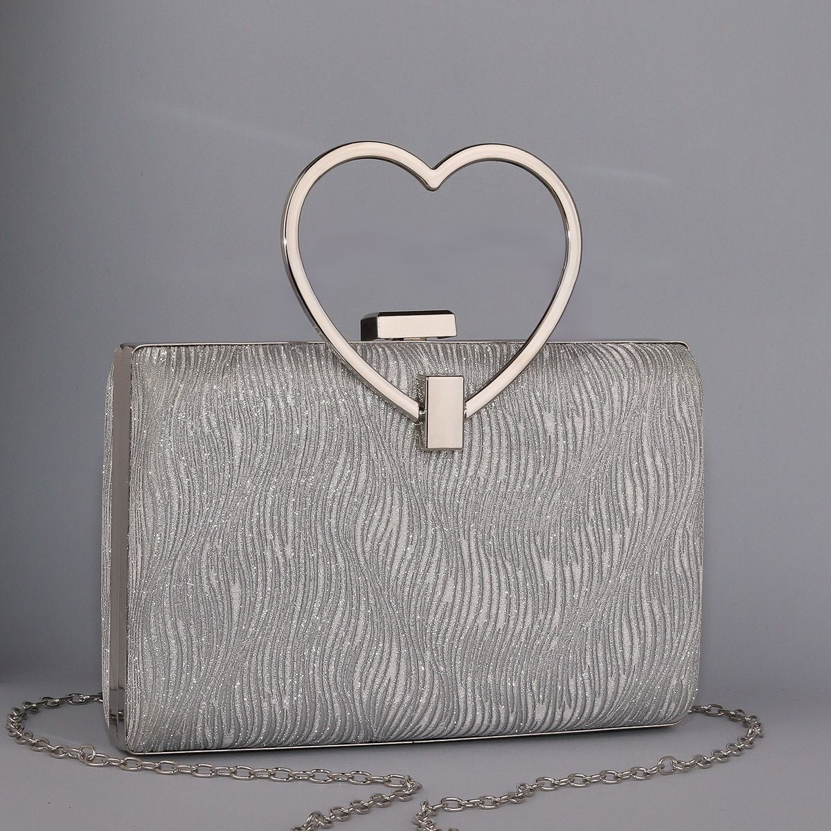 Wavy Pattern Shimmering Clutch with Heart-Shaped Handle