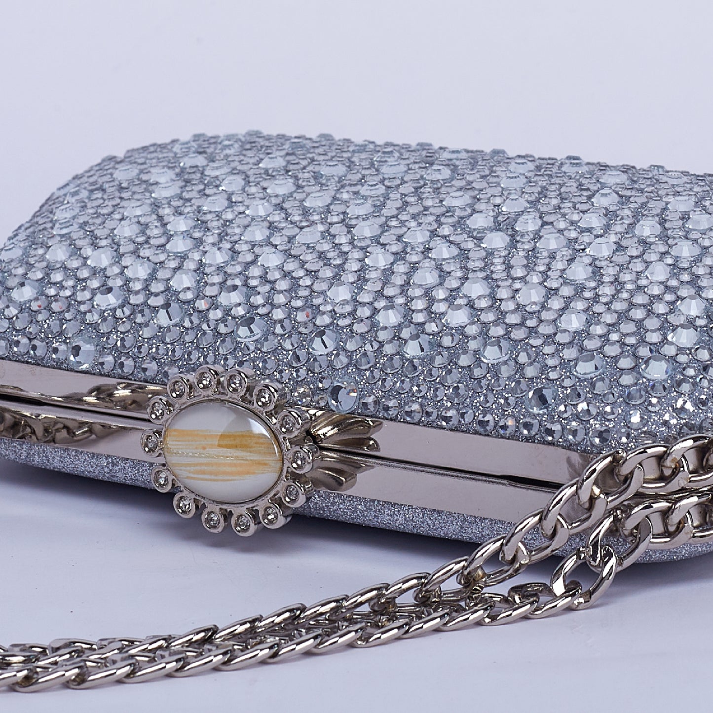 Vibrant Twilight Crystal-Encrusted Clutch with Gleaming double Chain Handle & Marble design lock