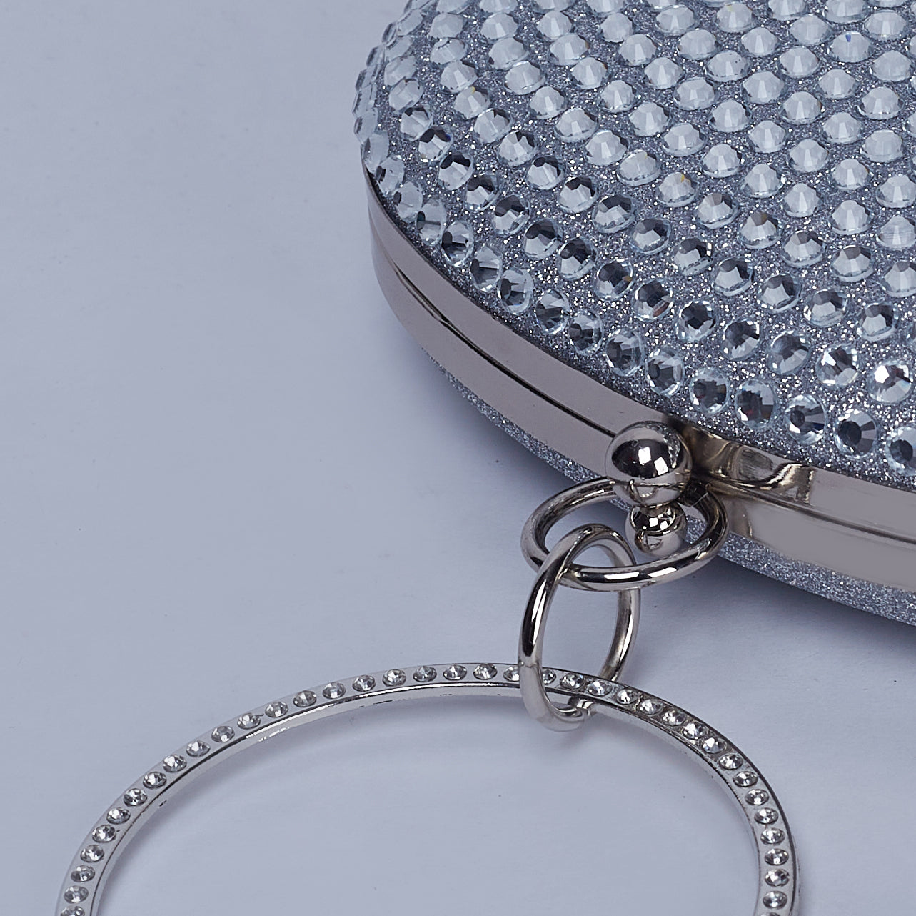 Glitz & Glam Oval Clutch with Circular Strass Handle with Glittering Chic Back